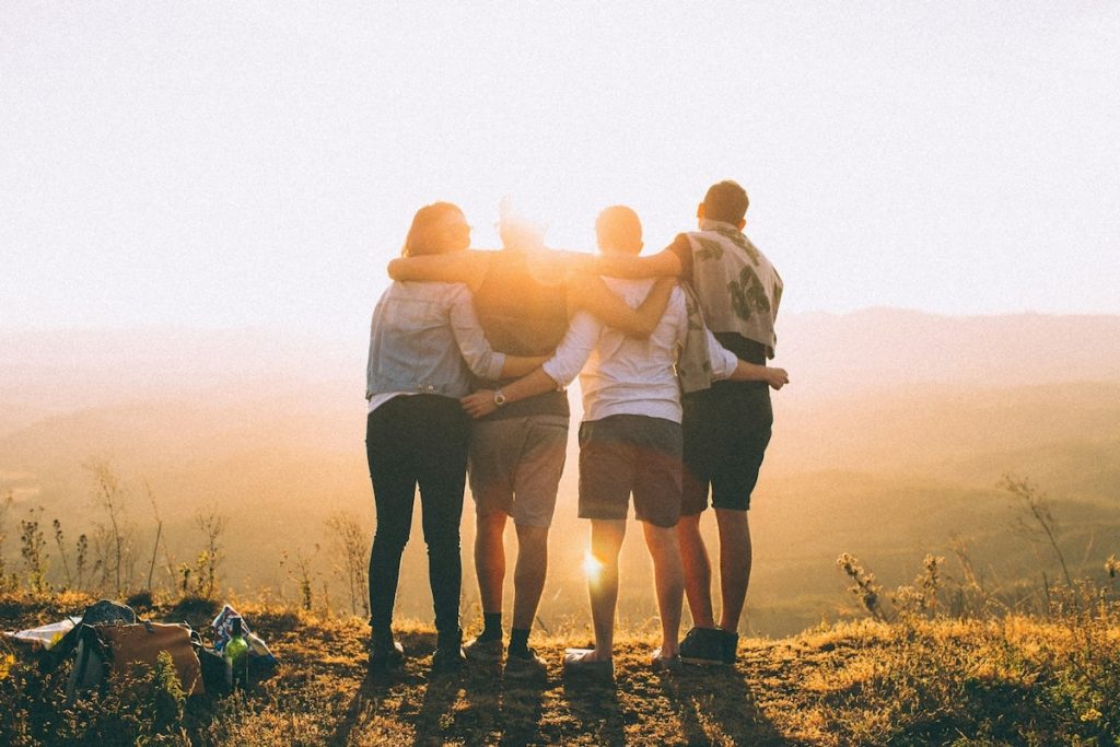 Beautiful sunny day with friends. Photo by Helena Lopes on Unsplash.
